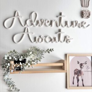 Adventure Awaits wall sign in kids bedroom above bed decor