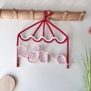 Personalized circus tent wall decor with pink name in baby girl nursery