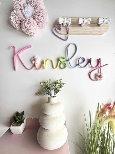 Personalised floral name wall decoration for nursery with custom lettering and flowers