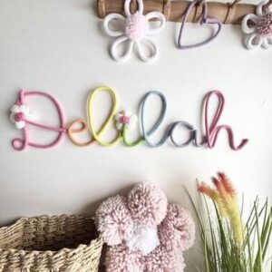Custom name sign with flower details for baby girl nursery or kids bedroom decor