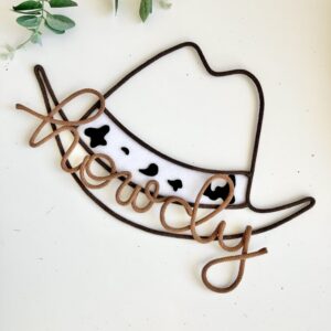 cowprint cowboy hat wall decor with howdy sign for kids room
