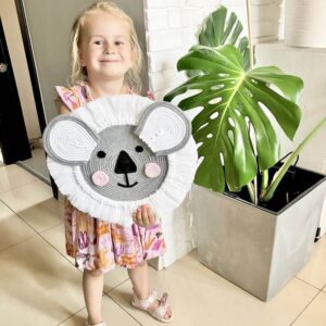 koalaa decoration for kids room held by a child