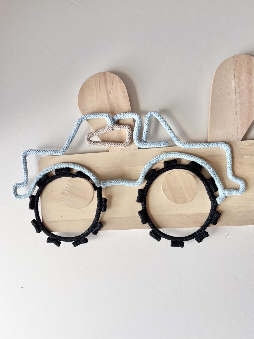 Playroom wall decor with large monster truck made from cotton cord