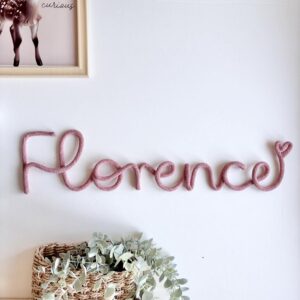 Personalized just for you – soft, stylish name signs that add charm to any space 🧵✨ These custom wire name signs are a beautiful way to personalize a nursery, kids' room, or playroom. Each word is handcrafted using sturdy wire wrapped in soft cotton cord, creating a playful and modern statement piece. Whether it’s for your own child or a thoughtful gift for someone special, these signs make a unique, handmade addition to any wall. 🎨 Available in a wide range of colors — please see all listing photos for options! Made of thick 9mm rope 🧵 Product Details: Made with cotton cord and strong wire Capital letters: approx. 12–14cm tall (5") Lowercase letters: approx. 5–6cm tall (2–2.5") Length depends on the number of letters in the name/word 📏 Approximate lengths by letter count: 4 letters: 34cm (13") 5 letters: 38cm (15") 6 letters: 40cm (16") 7 letters: 46cm (18") 8 letters: 56cm (22") 🎁 Perfect for: Baby showers Birthday gifts Nursery wall decor Playrooms or reading corners Personalized keepsakes Each piece is made to order with love and care — a one-of-a-kind name sign designed to celebrate your little one in a special way 💛