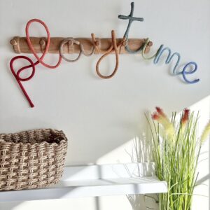 Multicoloured playroom sign with each letter in different colours for kids wall decor
