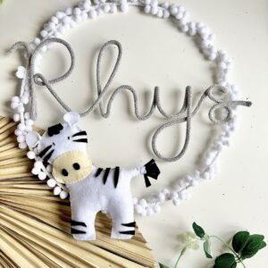 personalized zebra name plaque with pom pom circle for nursery