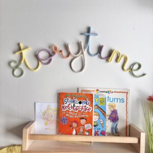 Colourful Storytime wall sign made from pastel rope lettering for kids bedroom, playroom or book nook decor