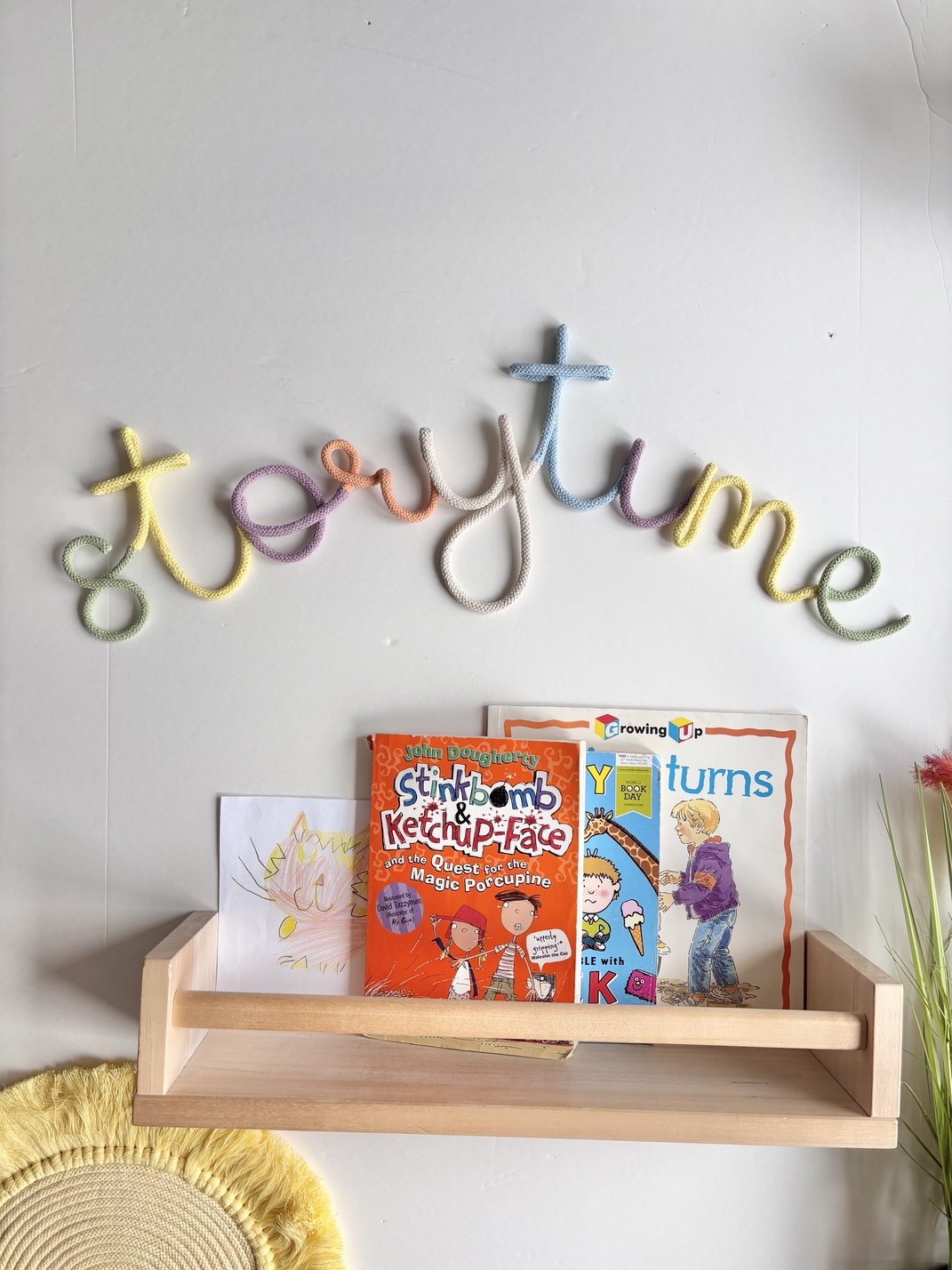 Colourful Storytime wall sign made from pastel rope lettering for kids bedroom, playroom or book nook decor