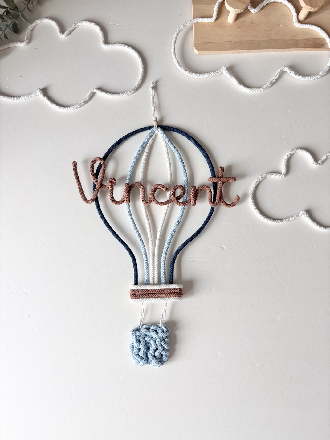 Custom hot air balloon wall decoration with child's name, perfect for nursery, kids bedroom, or playroom styling.