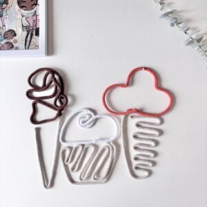 Neutral ice cream wall decor in white, brown, and pumpkin colours displayed on a wall