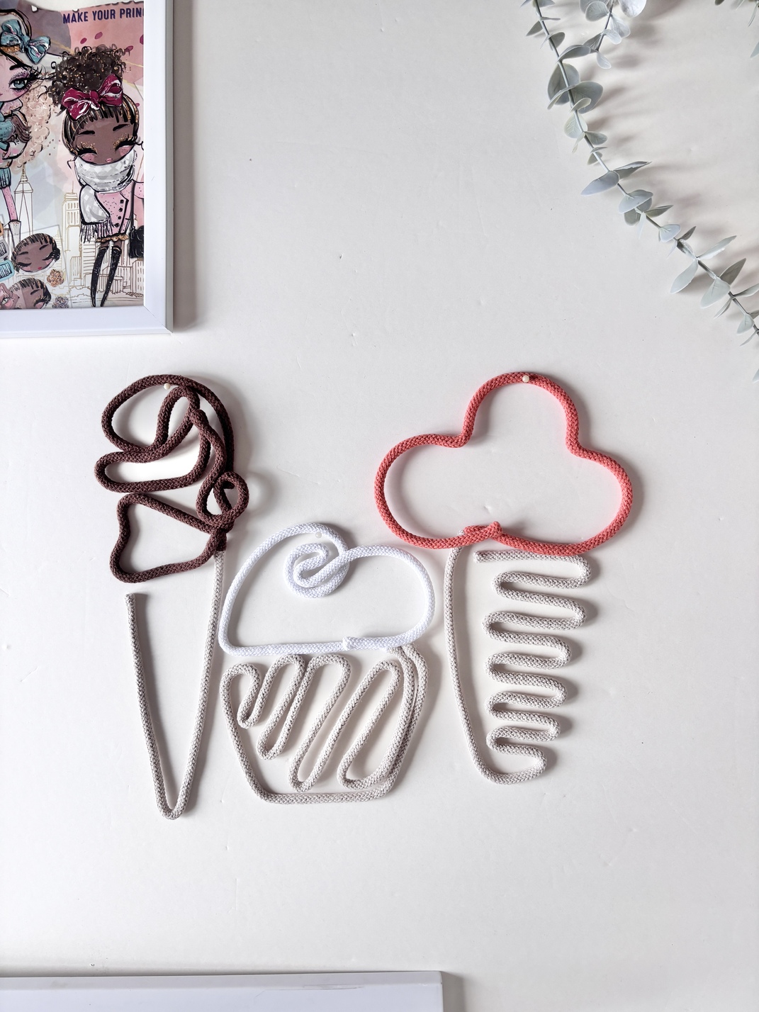 Neutral ice cream wall decor in white, brown, and pumpkin colours displayed on a wall