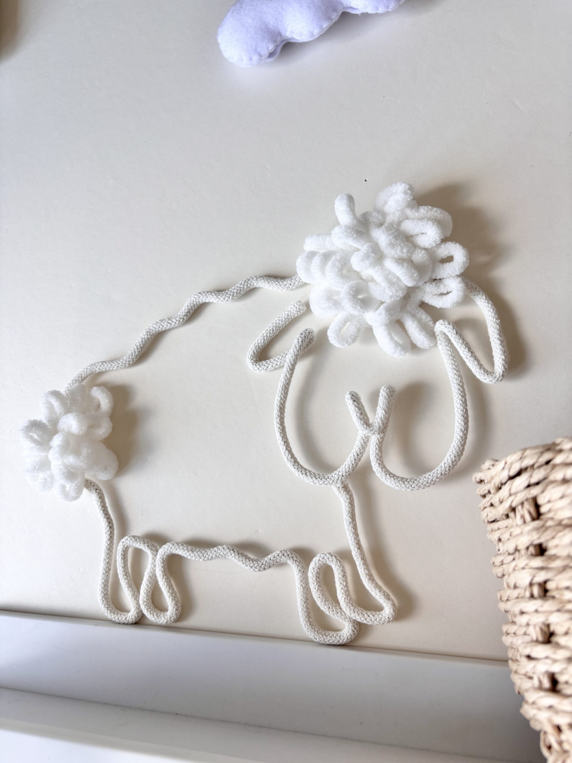 Cute sheep wall hanging for a nursery, perfect for farm-themed or Scandinavian baby room decor.