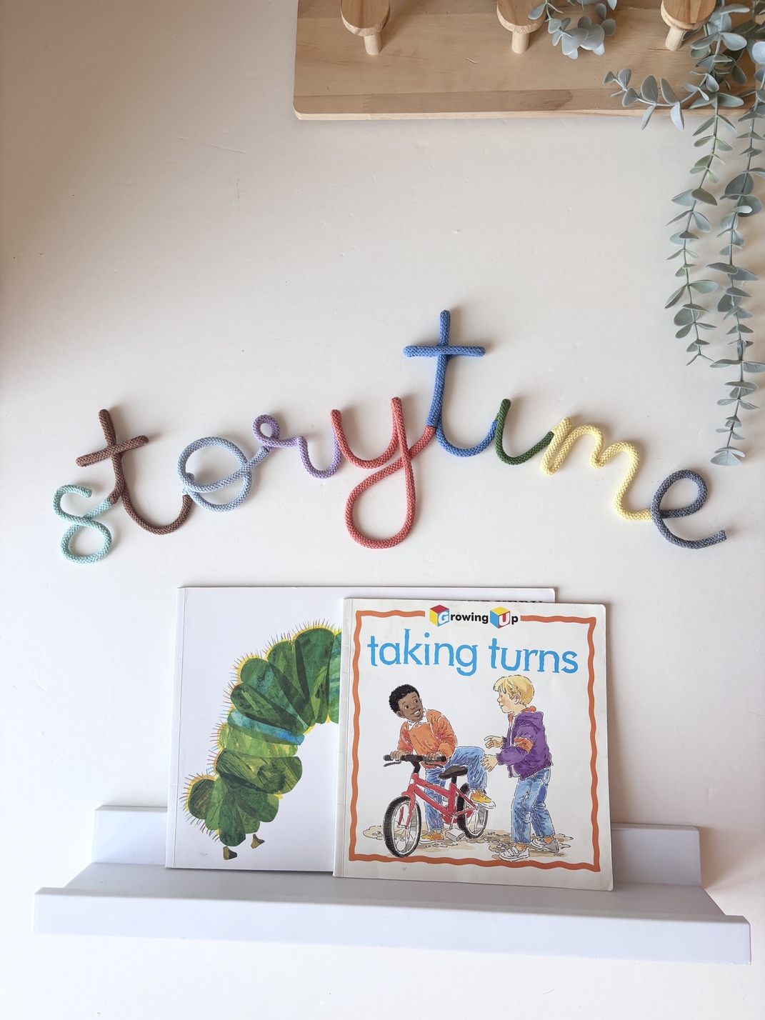 Colourful Storytime sign for a children's reading corner, handmade wall decor for a nursery, playroom, or classroom.