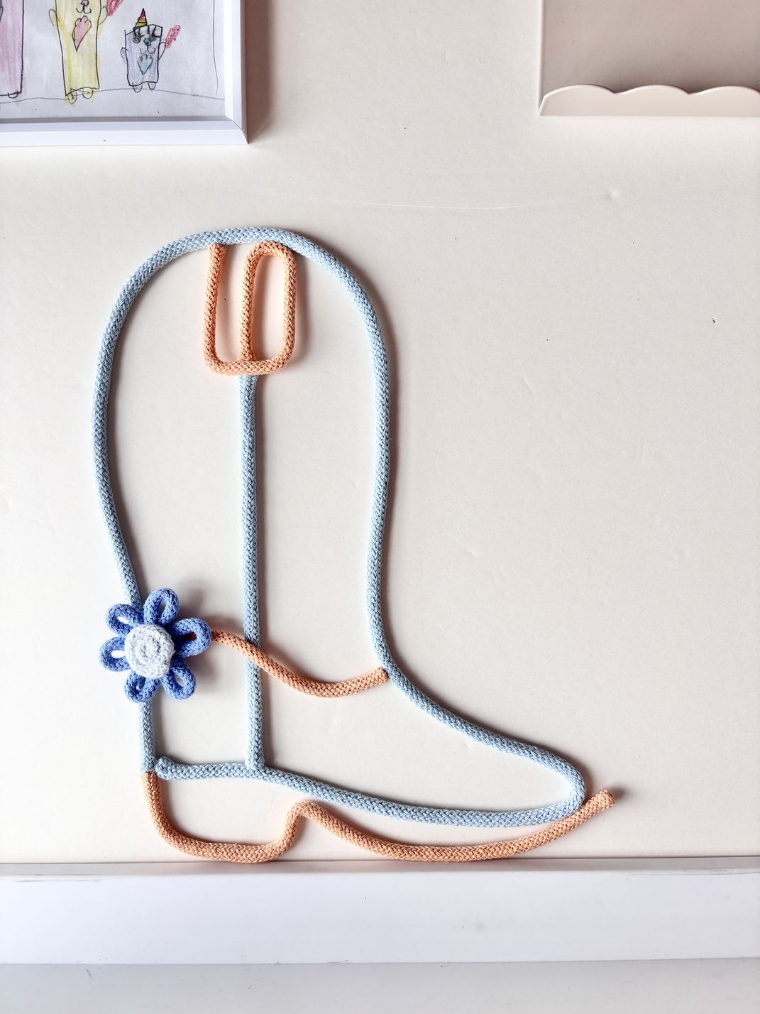 Handcrafted Western wall decor for a baby girl's nursery inspired by country and rodeo style.
