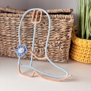 Cute cowgirl boot wall art displayed in a pastel Western themed nursery for girls.