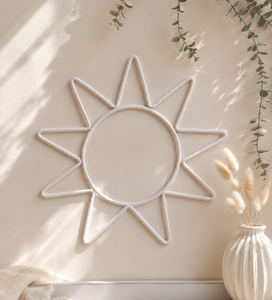 Minimalist cream sun nursery wall hanging with soft cotton cord, perfect for boho, Scandinavian and neutral baby room decor.