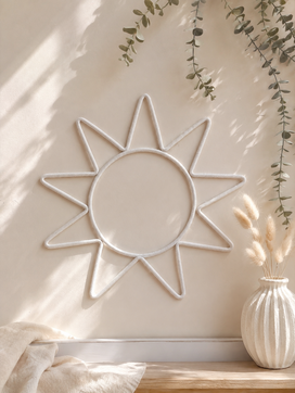 Minimalist cream sun nursery wall hanging with soft cotton cord, perfect for boho, Scandinavian and neutral baby room decor.
