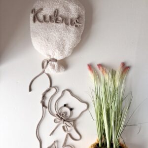 Personalized nursery wall decor set featuring a boucle name balloon and handmade teddy bear wall hanging in neutral colours.
