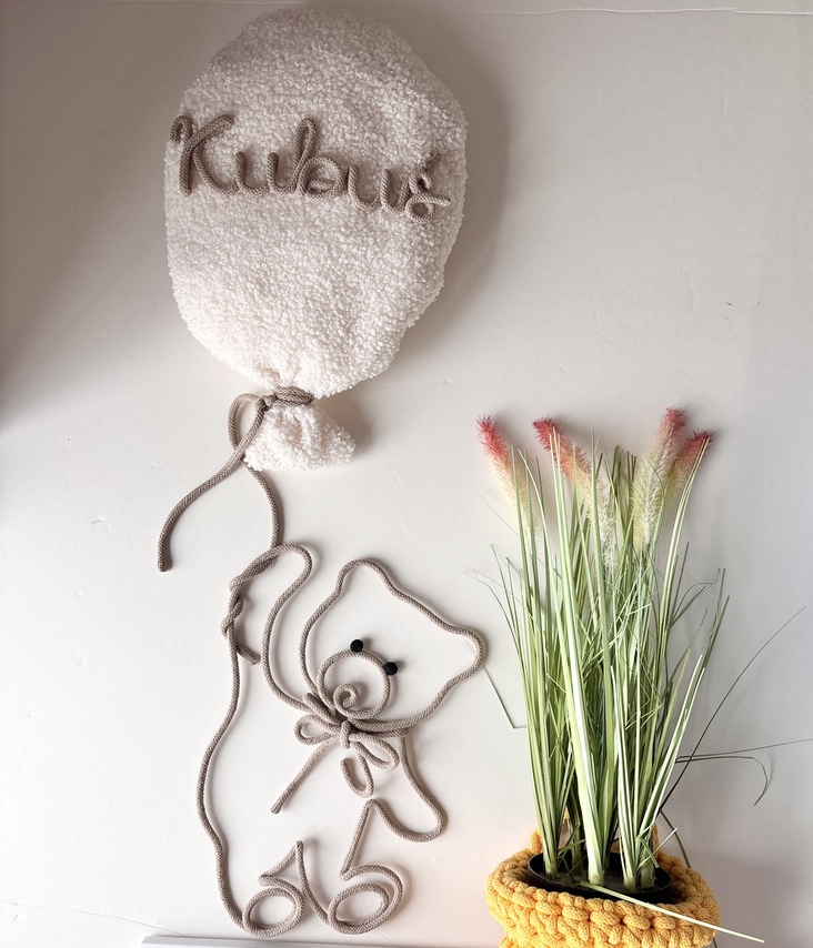 Personalized nursery wall decor set featuring a boucle name balloon and handmade teddy bear wall hanging in neutral colours.