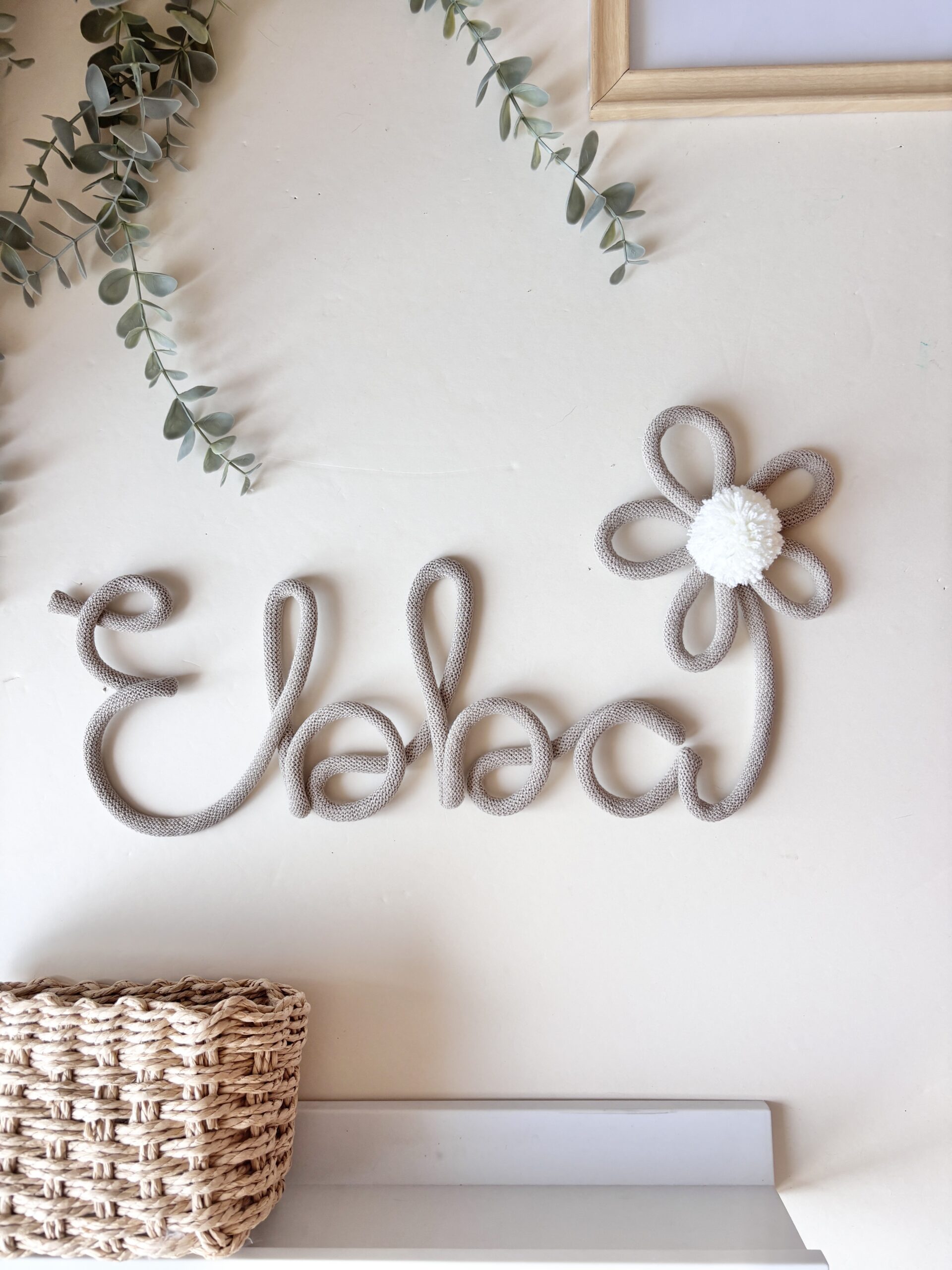 Handmade personalized daisy name sign with flower and pom pom for nursery wall decor