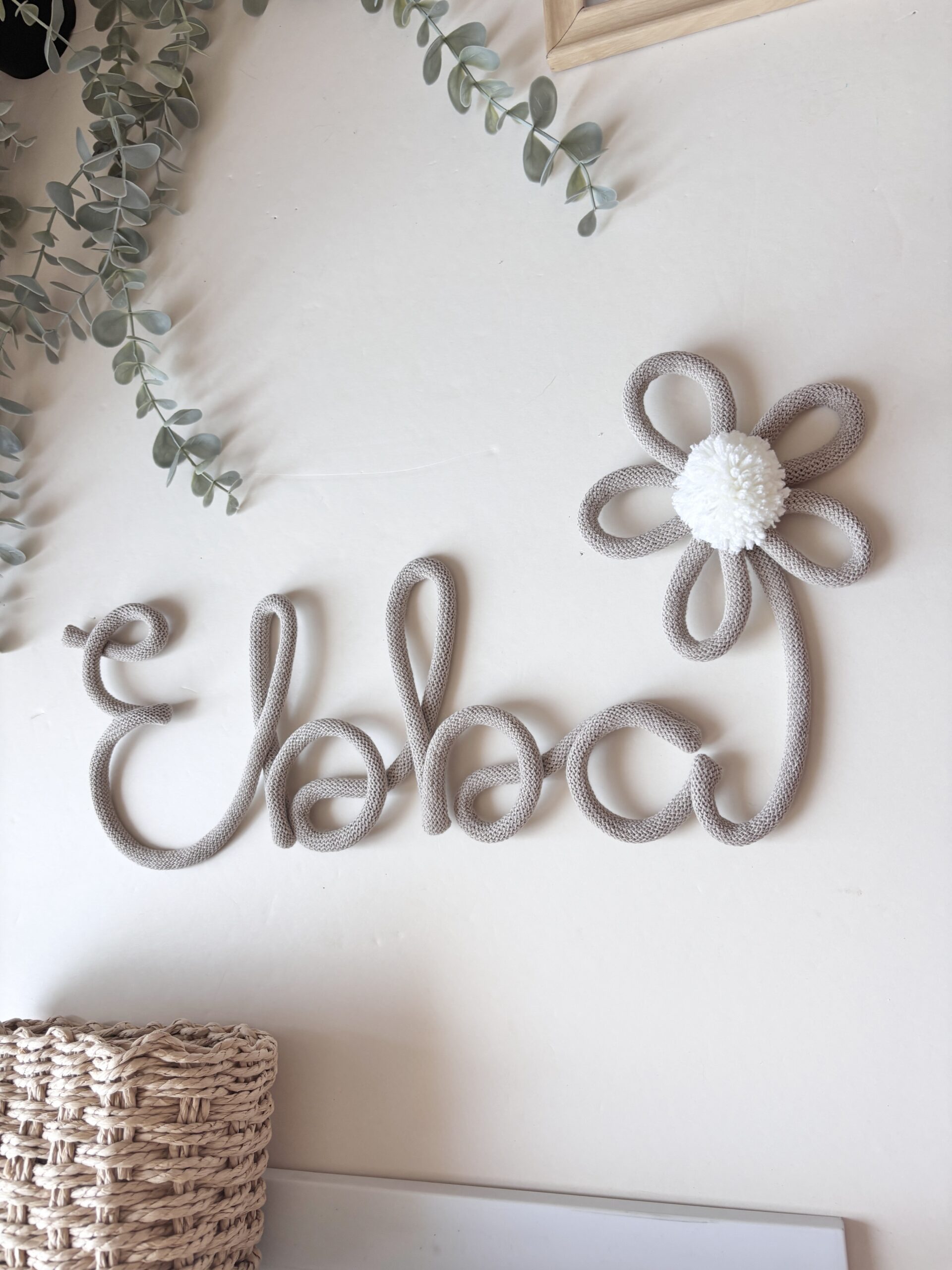 Custom handmade nursery name sign with daisy flower and pom pom